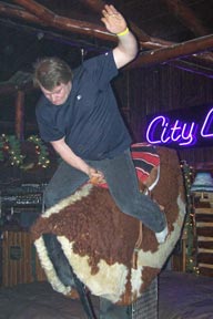 Photo: Man riding mechanical bull